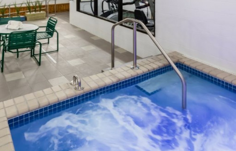 Running hot tub with seating nearby